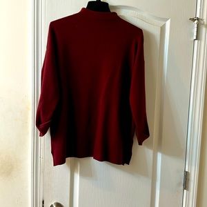 Mock neck sweater with cuff sleeves and side splits